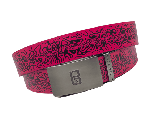Pink Chaos golf belt from Buca Belts, offering a vibrant and unique design. A perfect gift for golfers or those looking to add a stylish touch to their gear. Features a convenient ratchet buckle for easy adjustment.